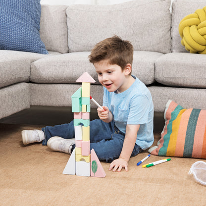 Child building with creative foam blocks after doodling